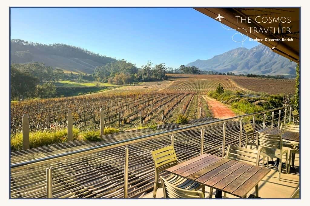 Tables and chairs on a terrace look out over this Stellenbosch vineyard.