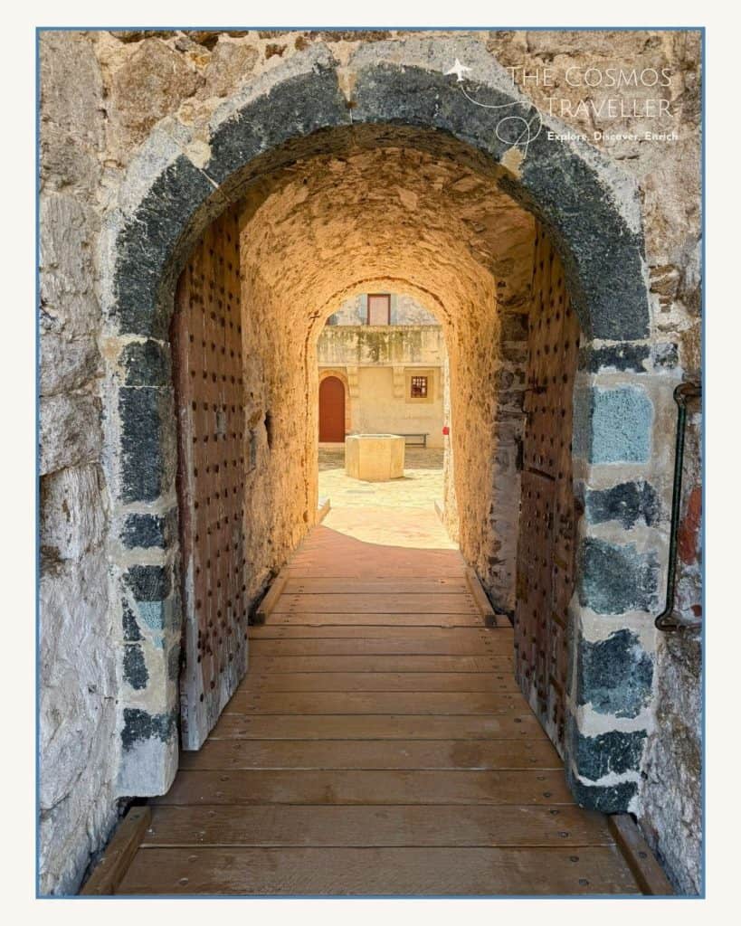 Stone arch entrance to the Citadel Museum in Saint-Tropez, showcasing maritime history and coastal views.
