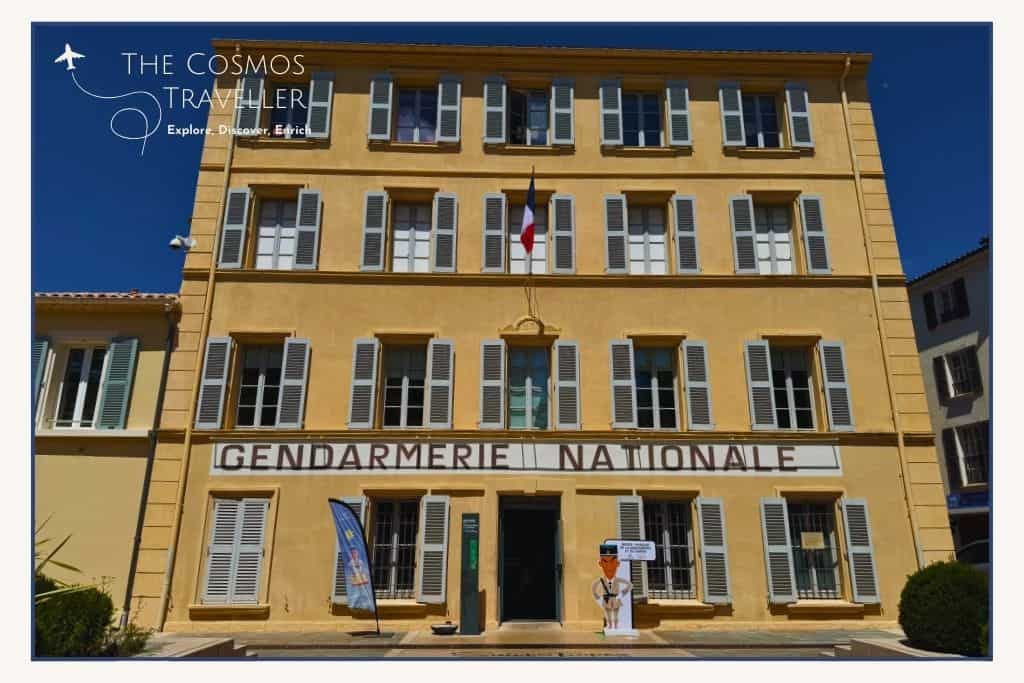 The iconic yellow Gendarmerie Nationale building in Saint-Tropez, famous from 1980s French cult films.