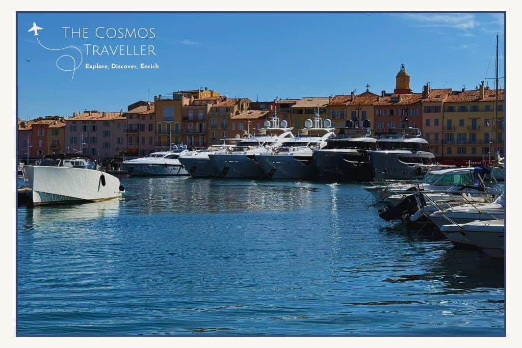 Superyachts line the harbour of Saint-Tropez, contrasting with small fishermen’s houses.