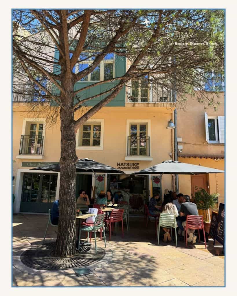 Hatsuké restaurant in Saint-Tropez, a popular Japanese venue, busy on a sunny day with outdoor diners