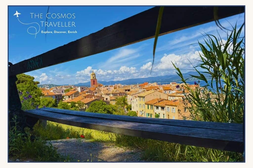 Rooftops of Saint-Tropez with the bell tower visible, seen from a bench beneath the citadel.