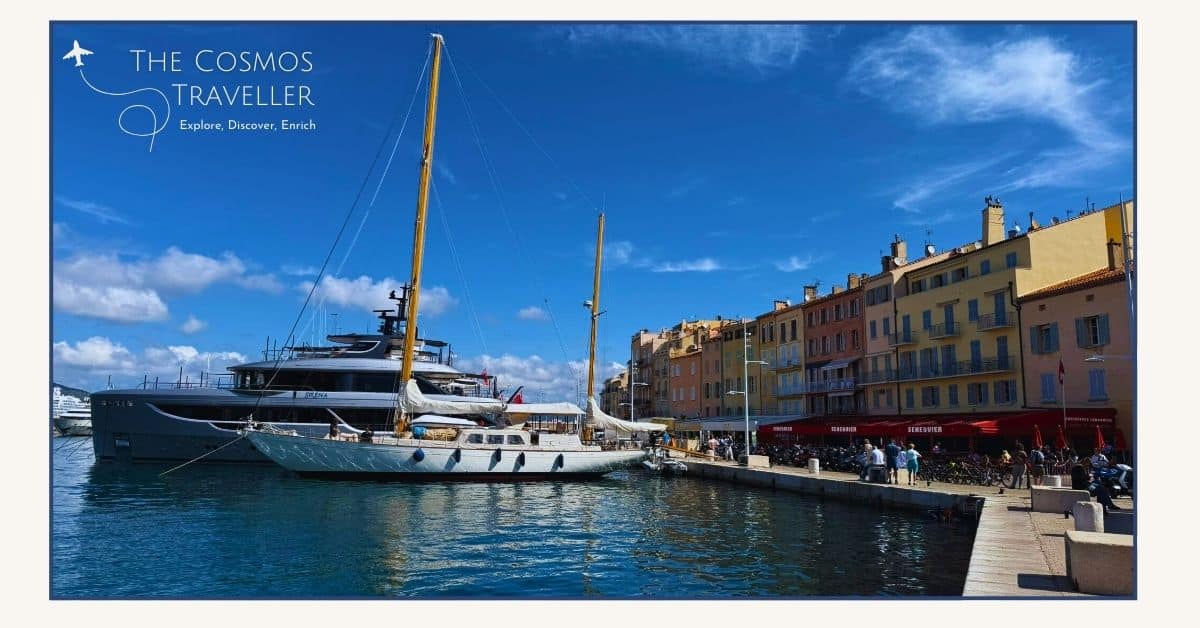 Superyachts in Saint-Tropez harbour contrast with pastel-coloured fishermen’s houses along the waterfront.