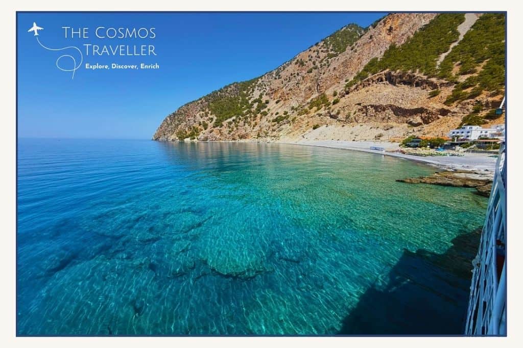 Agia Roumeli beach with clear blue water and visible seabed in southern Crete.