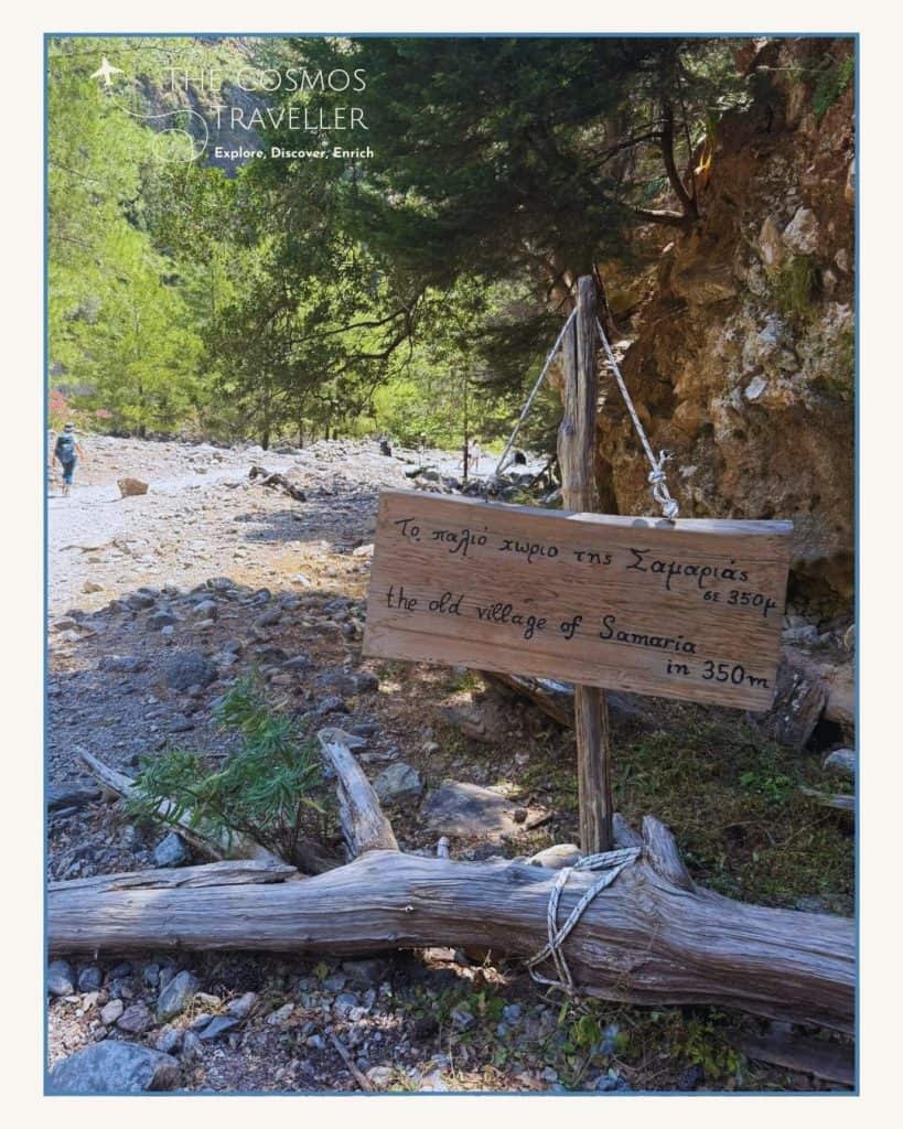 Trail signpost showing 350m to the old village of Samaria on the gorge hike.