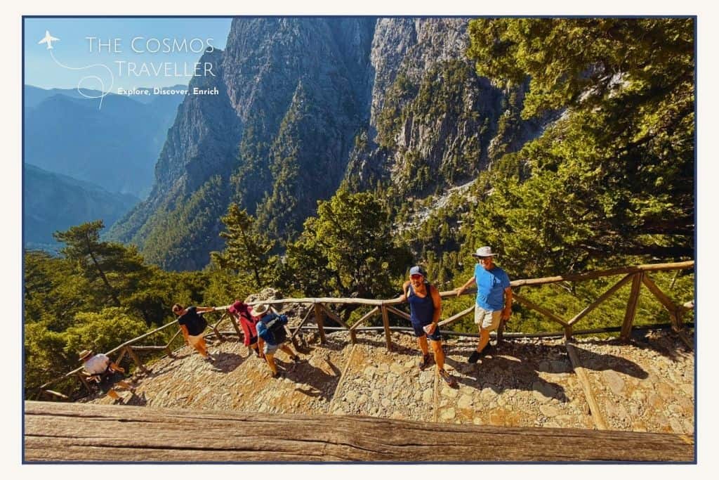 Hikers descending the steep trail at the start of the Samaria Gorge hike in Crete.