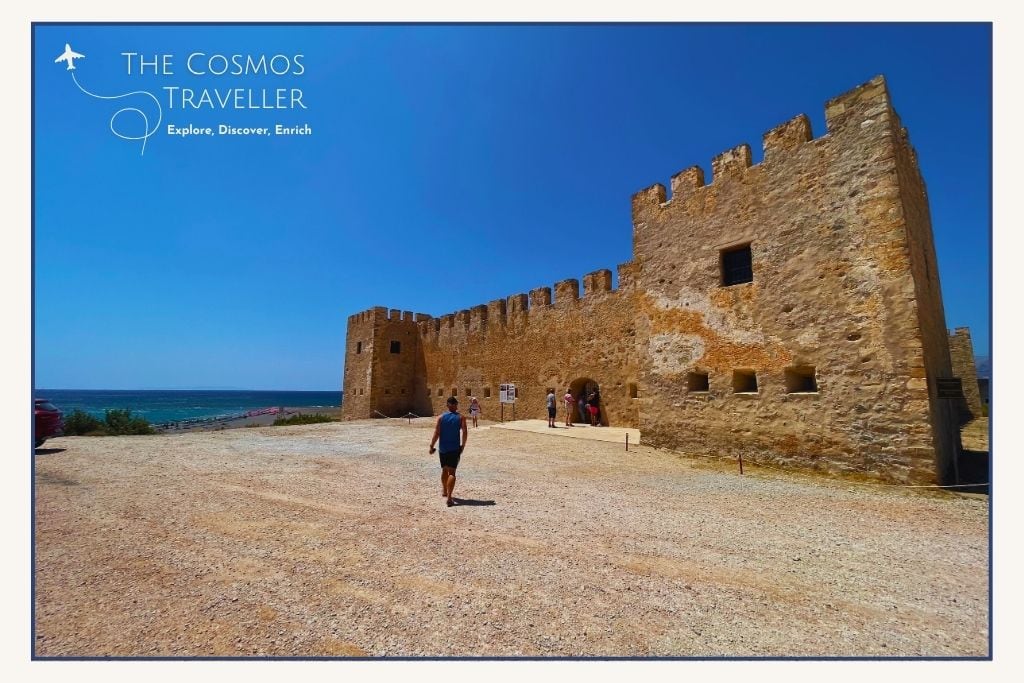 Seafacing entrance of Frangokastello Castle in Sfakia, Crete, with stone walls and ocean visible beyond.