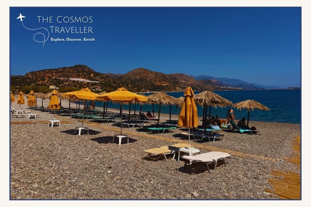 Long stretch of small pebble beach at Alonaki, Paleochora, Crete, peaceful and organised with sunbeds.