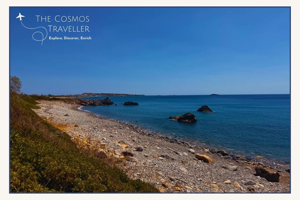 Roadside pebble and rocky strip at Kalamia Beach near Paleochora, Crete, clear water but limited appeal.