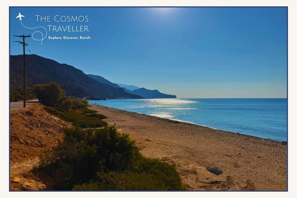 Pebble beach strip at Keratides near Paleochora, Crete, roadside access with quiet clear waters.