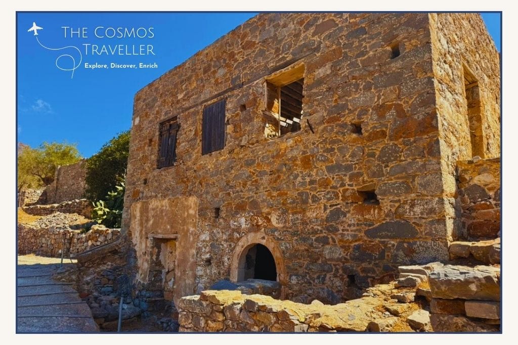 Crumbling stone house on Spinalonga Island, once inhabited by leper colony residents