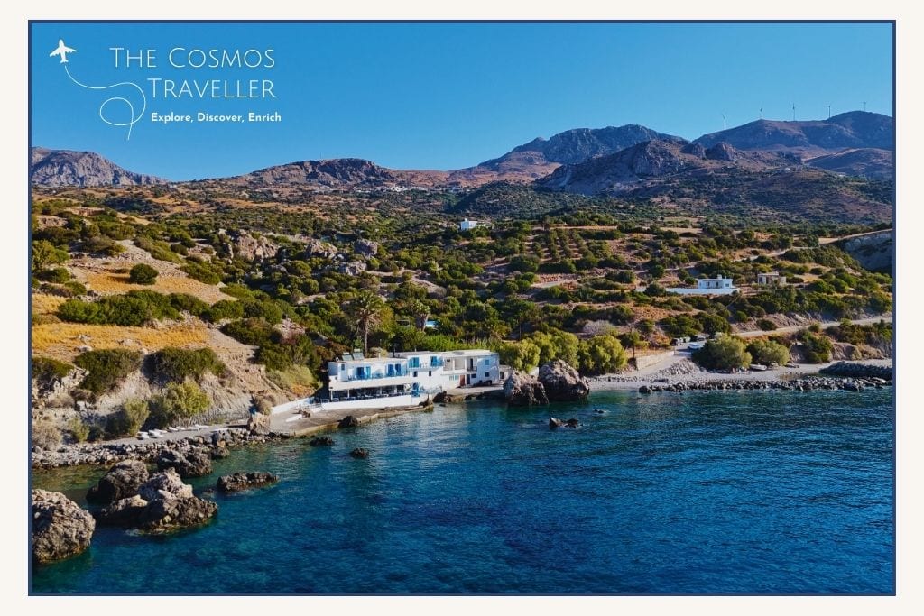 Drone view of Agia Fotia Beach with its seafront taverna — a traditional stop east of Plakias.