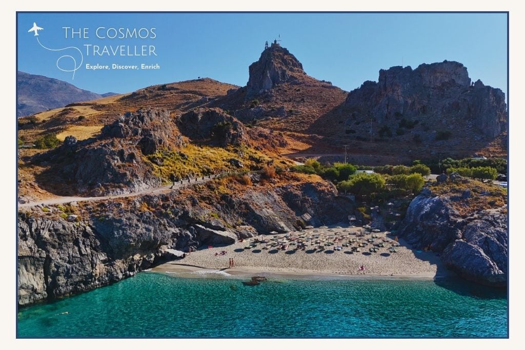 Drone shot of Ammoudaki Beach, a small turquoise cove and popular swimming spot among the Plakias beaches.