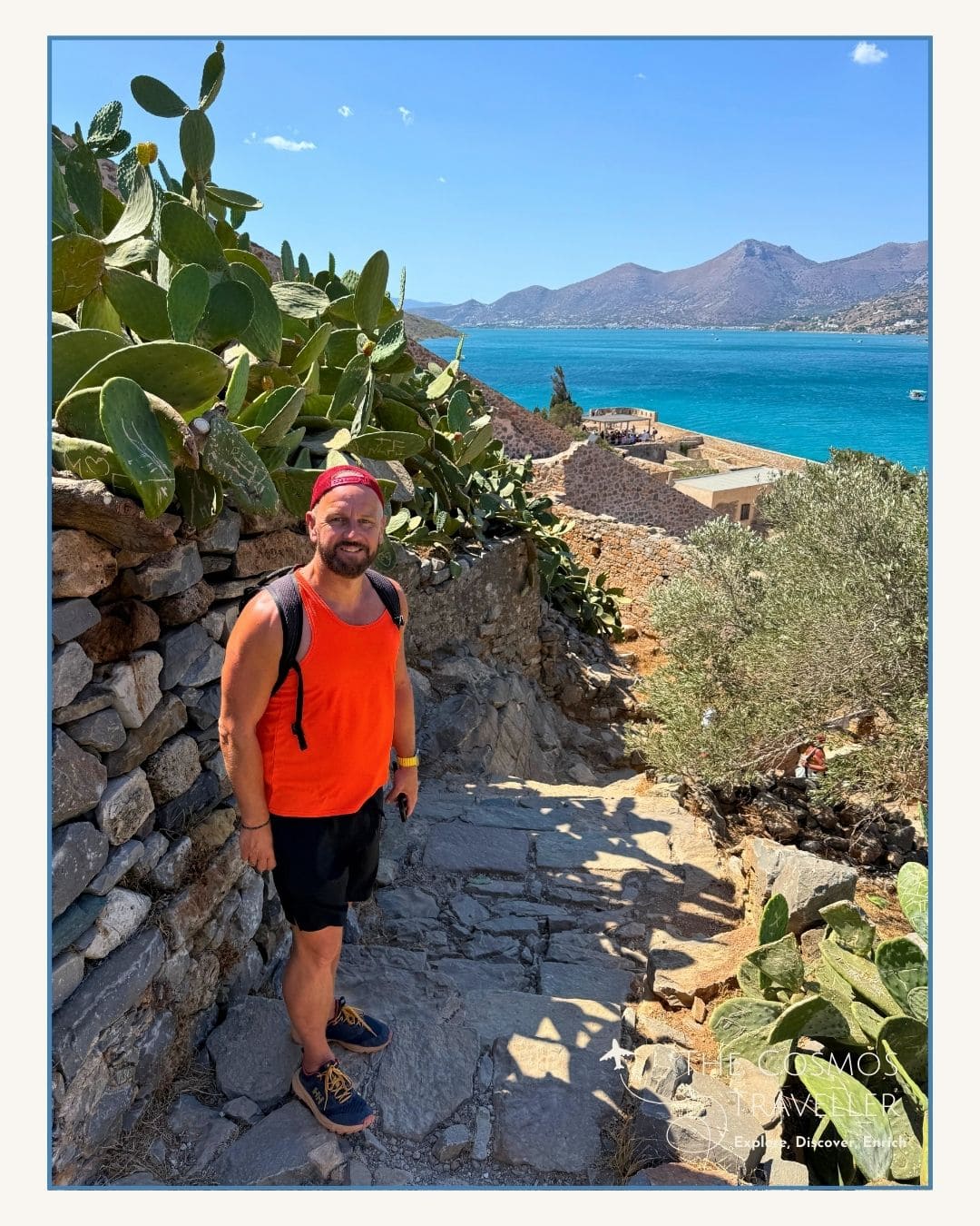 Hiker towards the summit of Spinalonga Island overlooking the sea