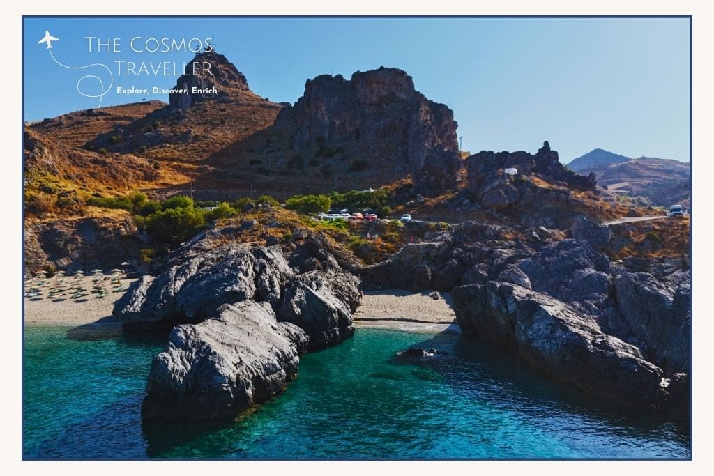 Drone view of Klisidi Beach, a tiny sheltered cove with blue waters just beside Ammoudaki Beach near Plakias.