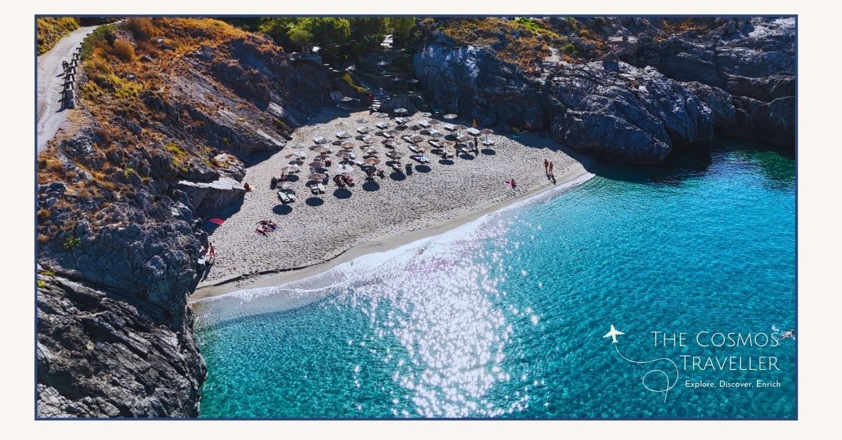 Drone view of Ammoudaki Beach, a small turquoise cove near Plakias, Crete — one of the most beautiful Plakias beaches for swimming.