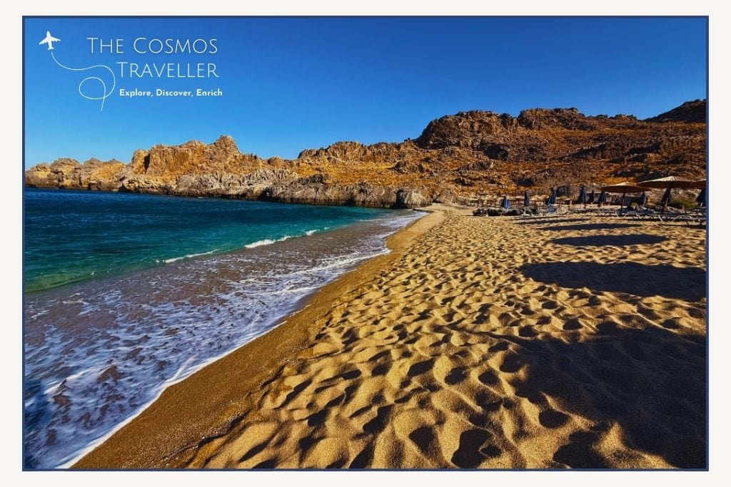 Shoreline photo of Skinaria Beach with pebbly sand and clear turquoise water, one of the best Plakias beaches for snorkeling.