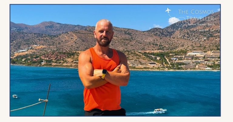 The Cosmos Traveller standing on the summit of Spinalonga Island in Crete. Plaka is seen in the distance.