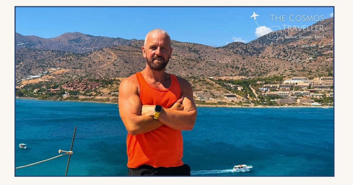 The Cosmos Traveller standing on the summit of Spinalonga Island in Crete. Plaka is seen in the distance.