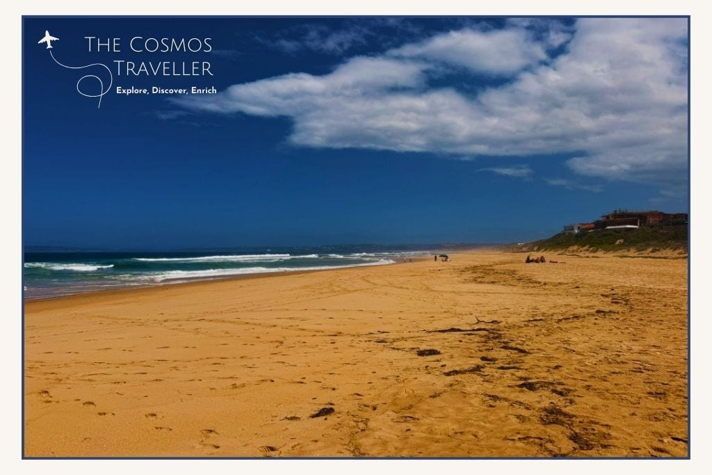 Main beach in Plettenberg Bay with wide sand and Indian Ocean views.