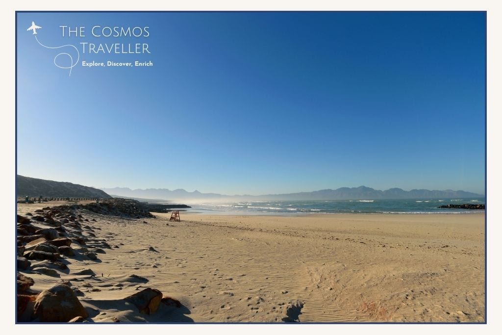 Surfers at Glen Beach between Clifton and Camps Bay in Cape Town