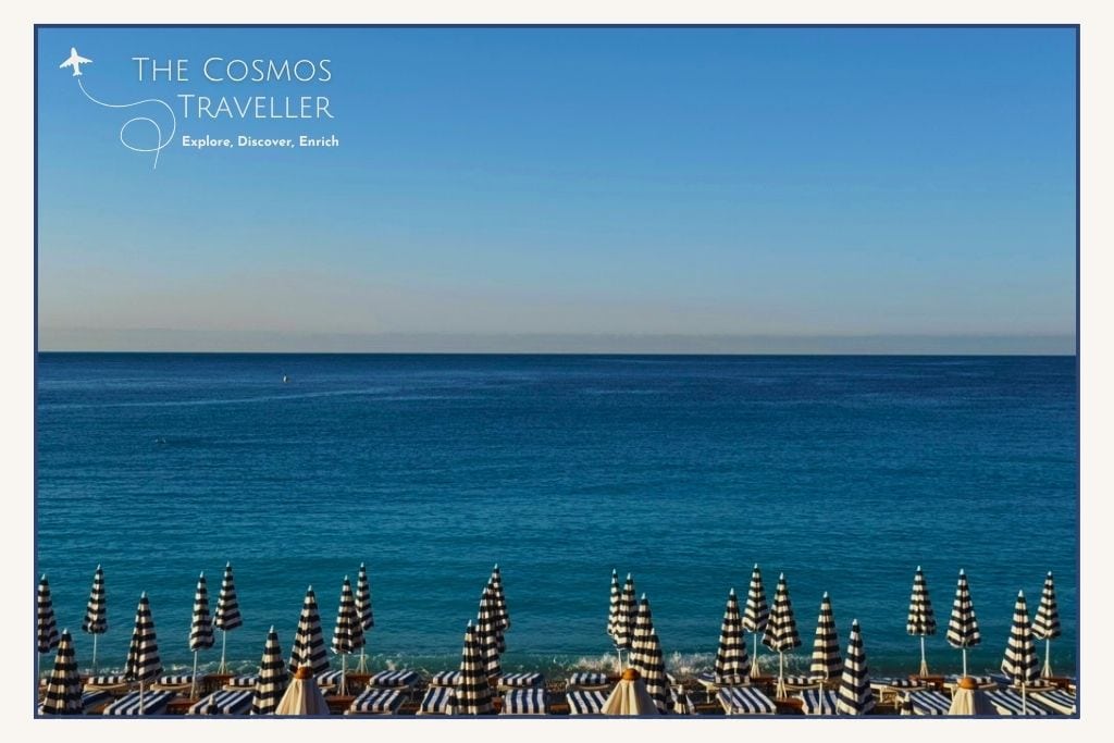 Colourful beach umbrellas along the Promenade des Anglais in Nice, France