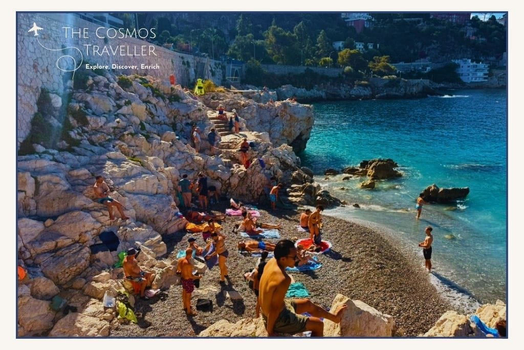 Clear turquoise water and rocky shoreline at Plage de la Réserve in Nice