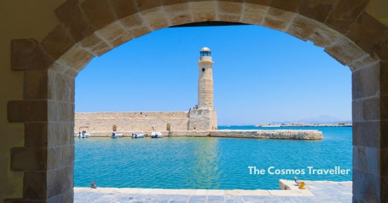View of Rethymno's Egyptian Lighthouse and harbour framed by a Venetian archway, Crete