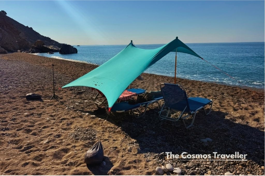 A salty tribe shade tarp set up on the sand at Glyka Nera beach, Crete.