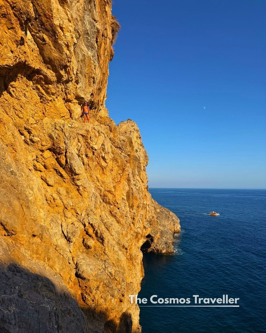 Steep cliff edge on the coastal path to Glyka Nera, Crete, with the sea directly below.