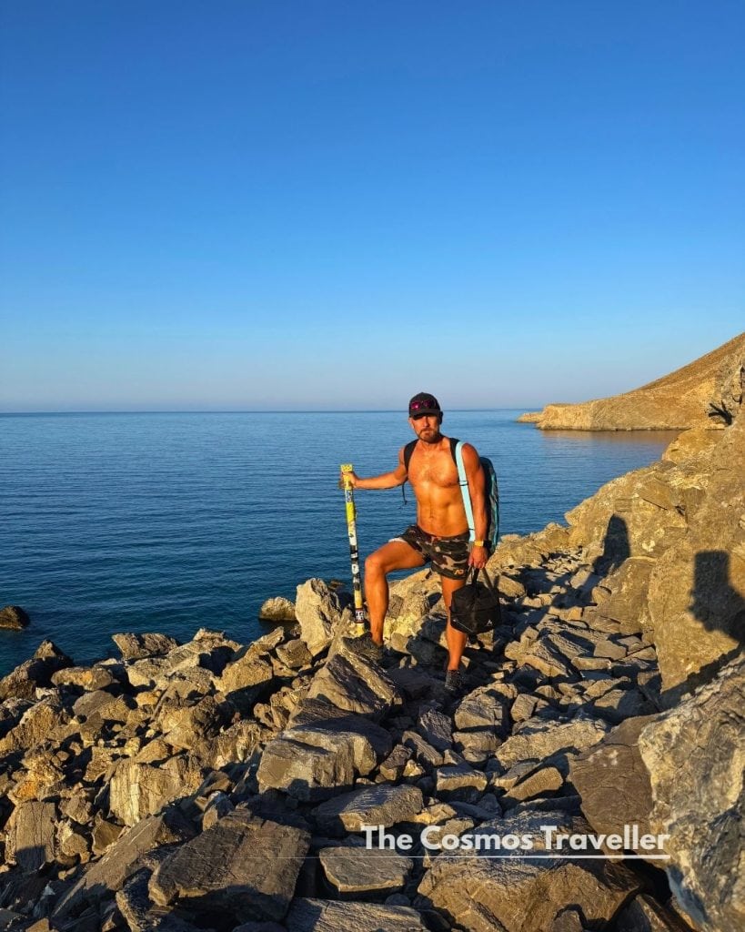 Richard Hoskisson resting on the rocky path above Glyka Nera beach, Crete.