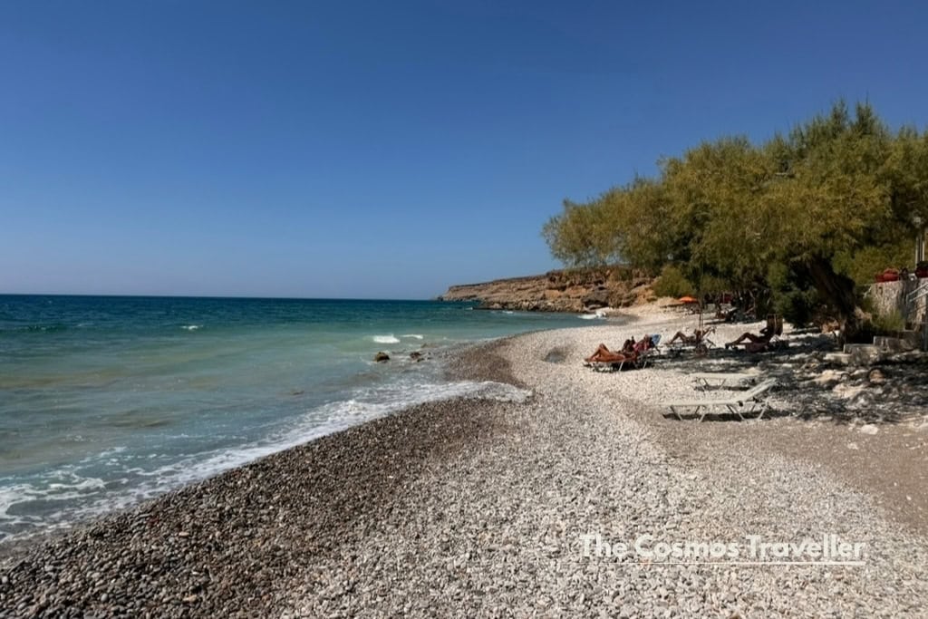 Koutelos beach with shaded sunbeds, home to the cheapest sunbeds I found in Crete